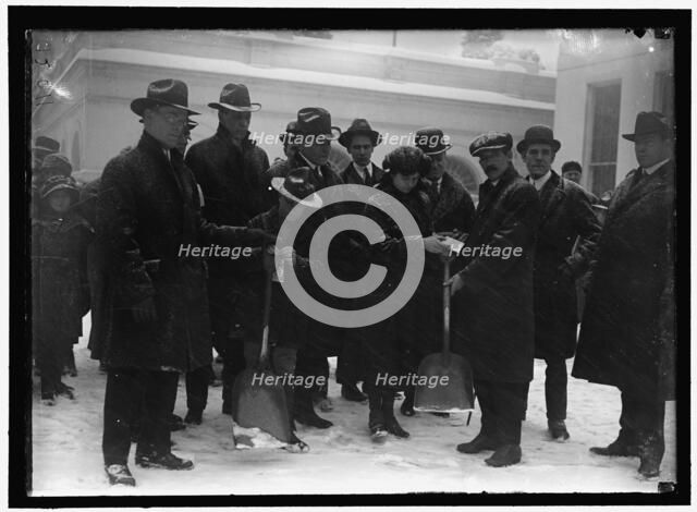 Group outside White House in snow, between 1913 and 1918. Creator: Harris & Ewing.