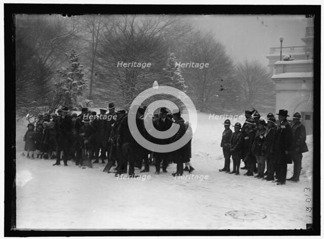 Group outside White House in snow, between 1913 and 1918. Creator: Harris & Ewing.