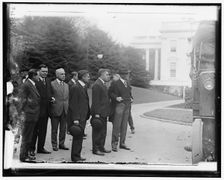 Group outside White House: includes Woodrow Wilson (right), and Newton..., between 1910 and 1920. Creator: Harris & Ewing