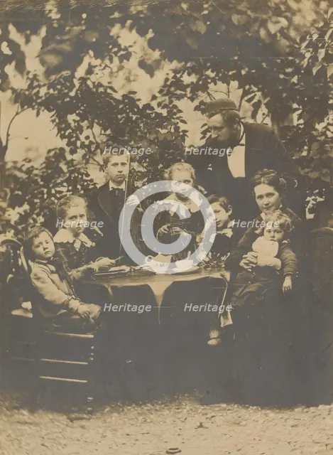 Group portrait around table, 1880-1890. Creator: Victor Dix.
