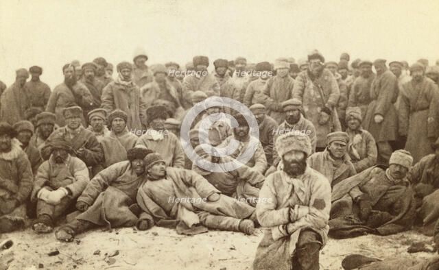 Group portrait of large group of convicts, between 1880 and 1886. Creator: Unknown.