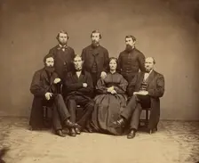 Group portrait of men and woman, about 1860-1869. Creator: Unknown