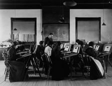 Group portrait of teacher and students at Hampton Institute painting watercolor..., 1899 or 1900. Creator: Frances Benjamin Johnston