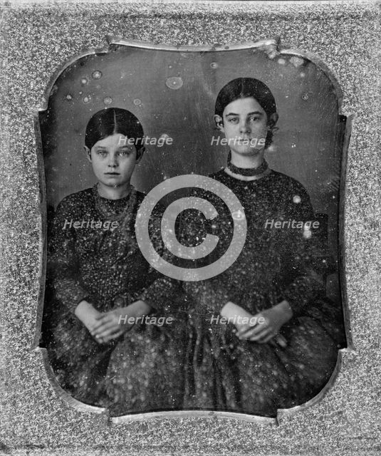 Group portrait of two unidentified girls, three-quarter length, seated, facing front, c1840 - 1860. Creator: Unknown.