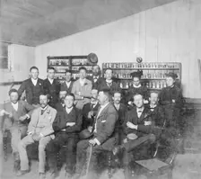 Group posed photo in classroom with Dr Wilton W.R. Love with Chemistry/Pharmacy students, 1894. Creator: Unknown
