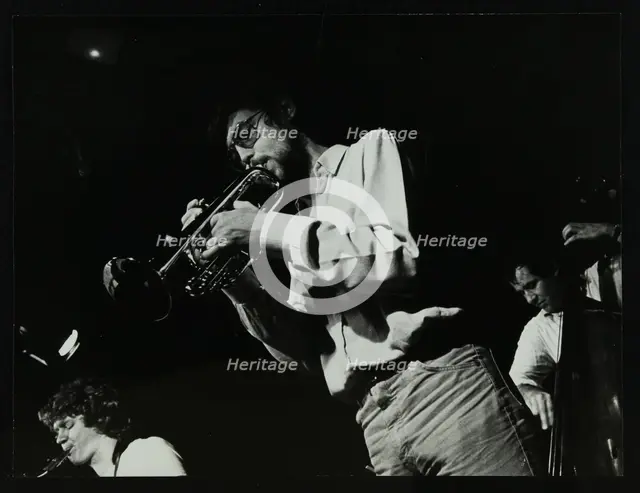 Guy Barker, Chris Hunter and Chris Laurence playing at The Stables, Wavendon, Buckinghamshire. Creator: Denis Williams.