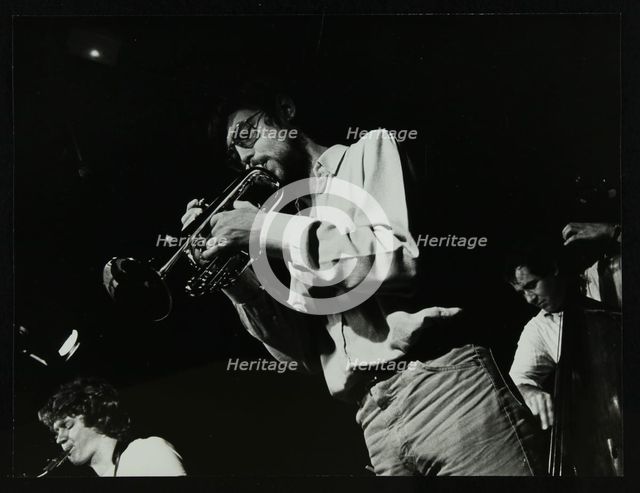 Guy Barker, Chris Hunter and Chris Laurence playing at The Stables, Wavendon, Buckinghamshire. Creator: Denis Williams.