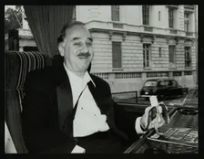 Guitarist Chuck Christiansen travelling by coach to the Royal Albert Hall, London, 28 May 1992. Creator: Denis Williams