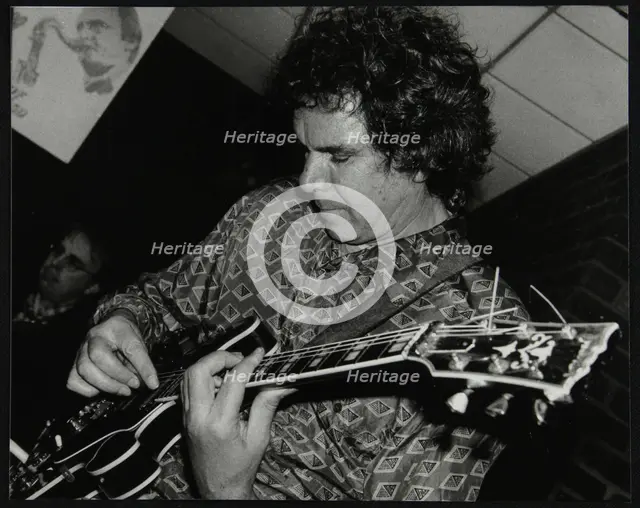 Guitarist John Etheridge playing at The Fairway, Welwyn Garden City, Hertfordshire, 9 November 2003. Creator: Denis Williams.
