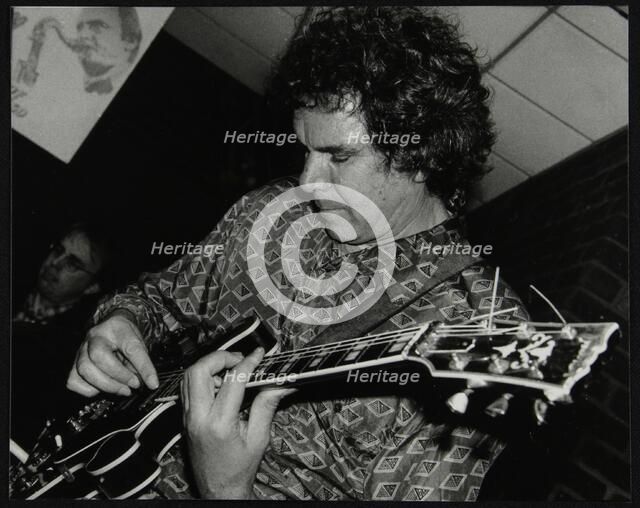 Guitarist John Etheridge playing at The Fairway, Welwyn Garden City, Hertfordshire, 9 November 2003. Artist: Denis Williams