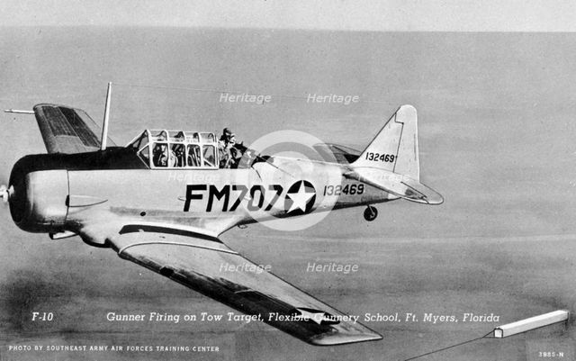 Gunner firing on a tow target, Flexible Gunnery School, Fort Myers, Florida, USA, 1943. Artist: Southeast Army Air Forces Training Center