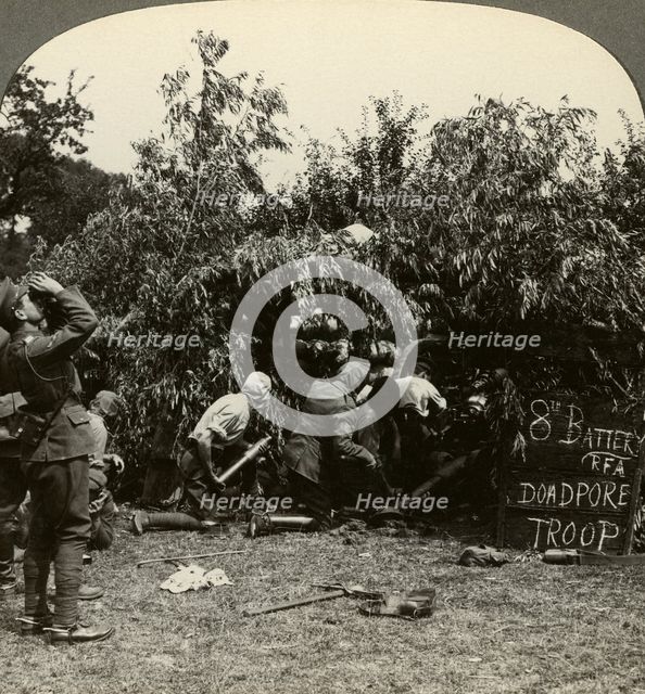 Gunners wearing gas masks, World War I, 1914-1918.Artist: Realistic Travels Publishers