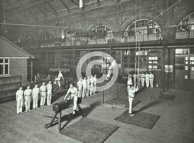 Gymnastics by male students, School of Building, Brixton, London, 1914. Artist: Unknown.