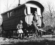 Gypsy children playing outside their caravan, 1960s