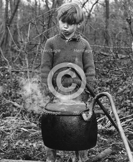 Gypsy boy with cauldron, 1960s.