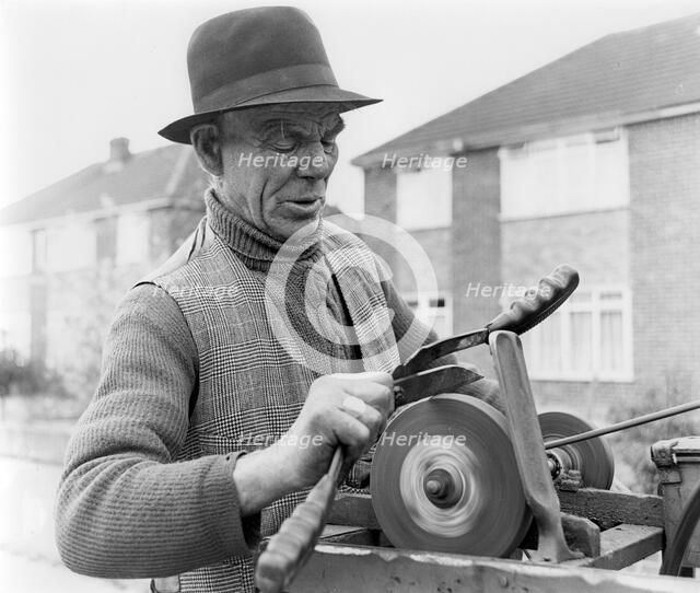 Gypsy knife-grinder, Horley, Surrey, 1964.