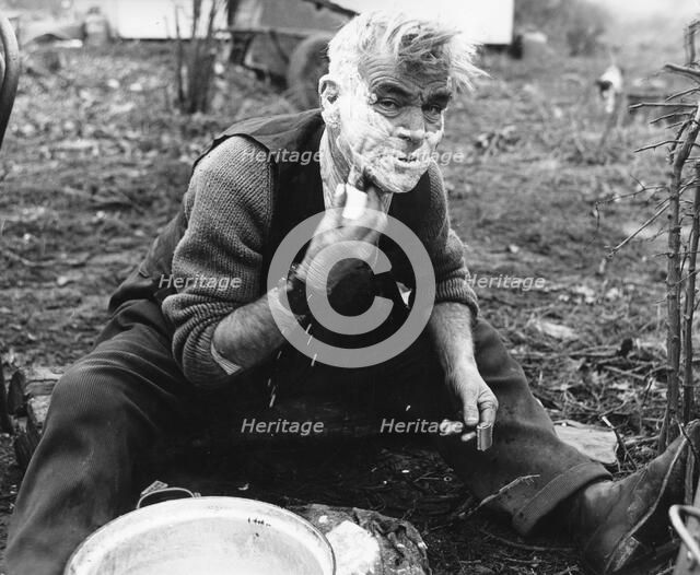 Gypsy man shaving, 1960s.