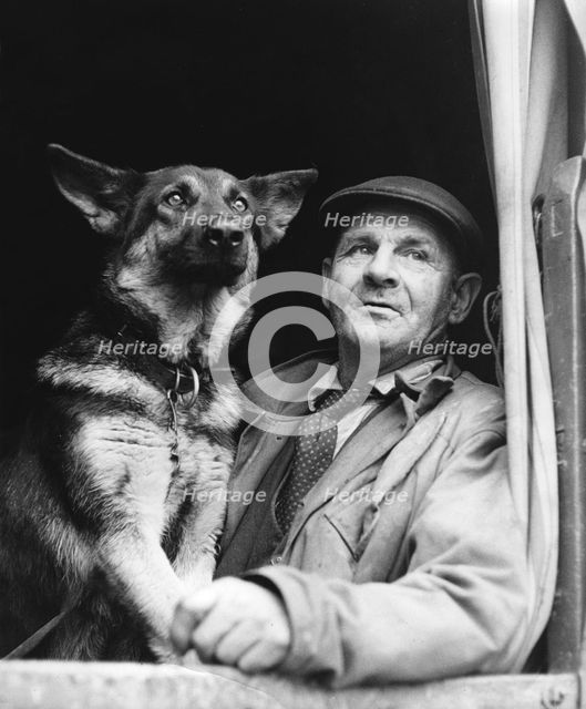 Gypsy man with dog, 1960s.