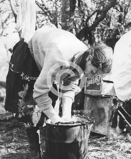 Gypsy woman washing clothes, 1960s.