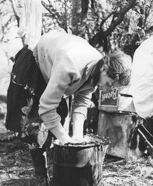 Gypsy woman washing clothes, 1960s