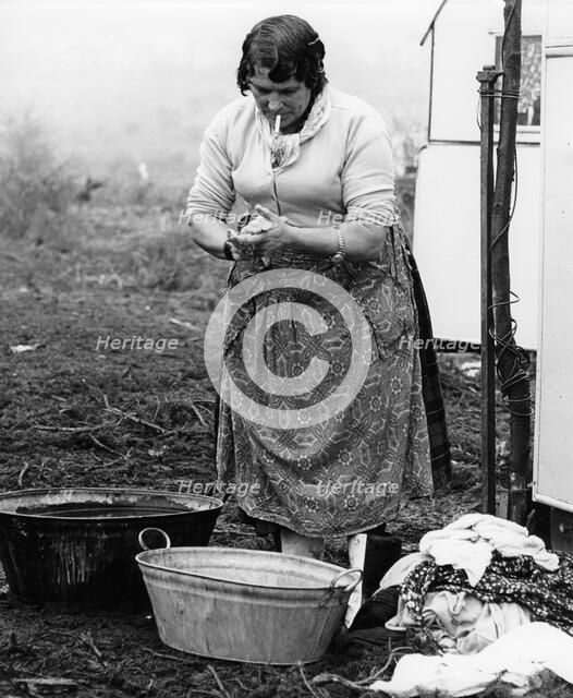 Gypsy woman washing clothes, 1960s.