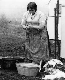 Gypsy woman washing clothes, 1960s