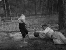 Dmitri Shostakovich plays football with his son Maxim in Komarovo, 1947. Creator: Varzar Shostakovich, Nina Vasilyevna (1909-1954)