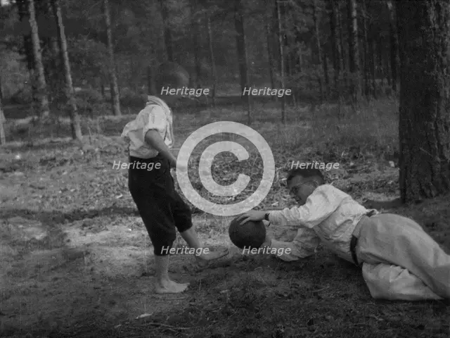 Dmitri Shostakovich plays football with his son Maxim in Komarovo, 1947. Creator: Varzar Shostakovich, Nina Vasilyevna (1909-1954).