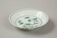 Doucai saucer with fruiting peach, late Kangxi period (1700-1722). Creator: Unknown