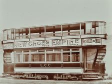 Double-decker electric tram with advertisement for the New Cross Empire, 1907