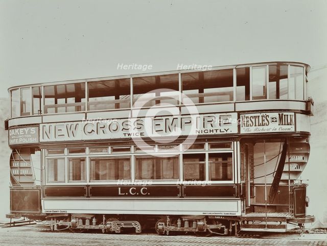 Double-decker electric tram with advertisement for the New Cross Empire, 1907. Artist: Unknown.