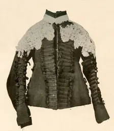 Doublet of black cloth trimmed with silk braid and crochet buttons c17th century, (1937). Creator: Unknown