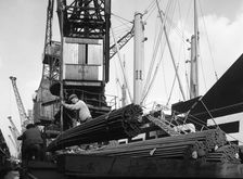 Dockers loading steel bars onto the Manchester Renown Manchester, 1964. Artist: Michael Walters