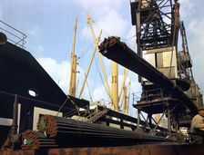 Dockers loading steel bars onto the Manchester Renown Manchester, 1964. Artist: Michael Walters
