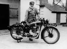 Donald Campbell outside a garage at Headley Grove, Surrey, 1938