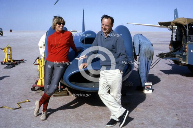 Donald Campbell with his wife Tonia and Bluebird CN7, Lake Eyre, Australia, 1964. Creator: Unknown.