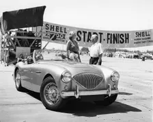 Donald Healey with an Austin Healey at a motor race