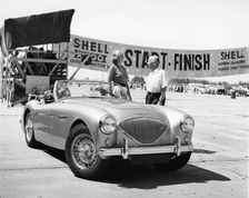 Donald Healey with an Austin Healey at a motor race