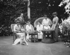 Donohoe, Mrs., and friends or family, portrait photograph taken outdoors, between 1906 and 1915. Creator: Arnold Genthe