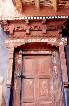 Door with skulls and faces, Ladakh, India, 1988. Creator: Amanda Waite