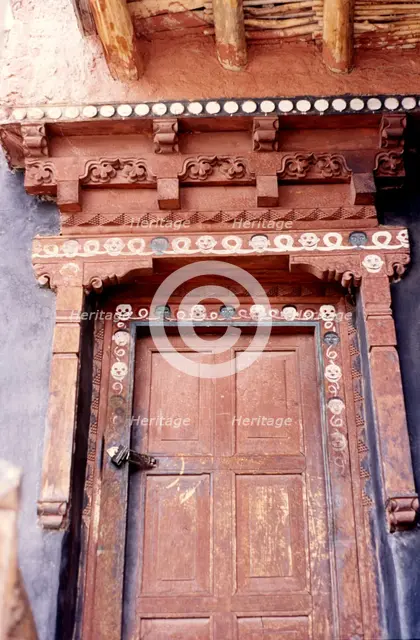 Door with skulls and faces, Ladakh, India, 1988. Creator: Amanda Waite.