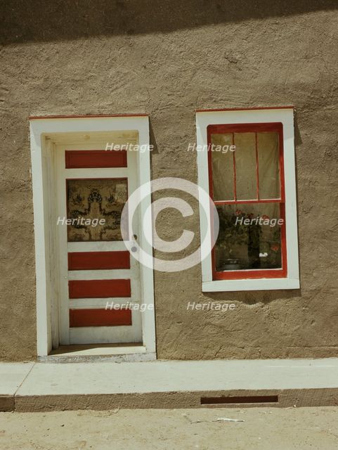 Door and window in a Spanish-American home, Costilla, New Mexico, 1940. Creator: Russell Lee.