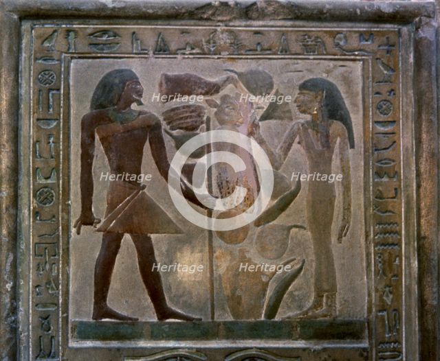 Door shaped stela representing Senouret and his wife in front of their offerings, made in polychr…