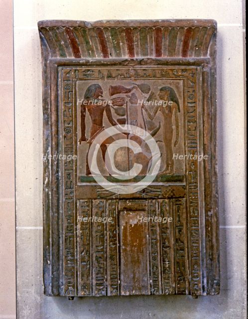 Door shaped stela representing Senouret and his wife in front of their offerings, made in polychr…