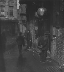 Doorways in dim shadows, Chinatown, San Francisco, between 1896 and 1906. Creator: Arnold Genthe