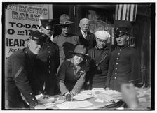 Dora Rodrigues, recruiter for service branches, possibly in front of the Cosmos Theater..., May 1917 Creator: Harris & Ewing