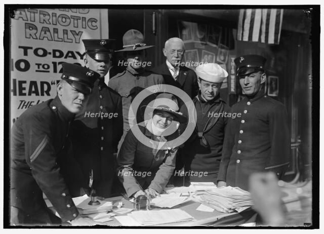Dora Rodrigues, recruiter for service branches, possibly in front of the Cosmos Theater..., May 1917 Creator: Harris & Ewing.