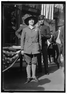 Dora Rodrigues, recruiter for service branches, possibly in front of the Cosmos Theater..., May 1917 Creator: Harris & Ewing