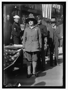 Dora Rodrigues, recruiter for service branches, possibly in front of the Cosmos Theater..., May 1917 Creator: Harris & Ewing