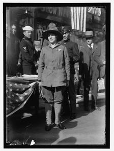 Dora Rodrigues, recruiter for service branches, possibly in front of the Cosmos Theater..., May 1917 Creator: Harris & Ewing